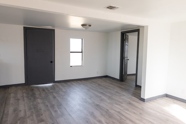 empty room featuring wood-type flooring