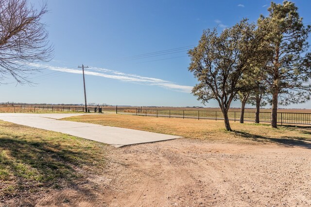 view of yard with a rural view