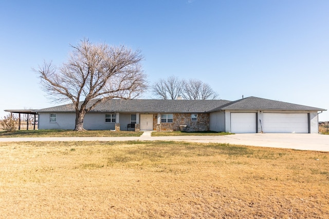 ranch-style house with a garage and a front yard