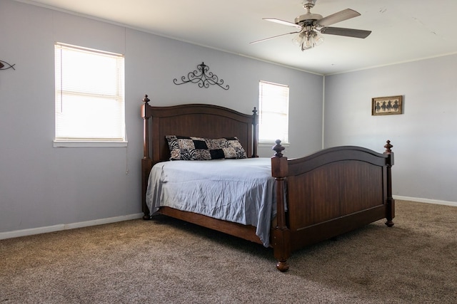 bedroom with crown molding, ceiling fan, and carpet flooring