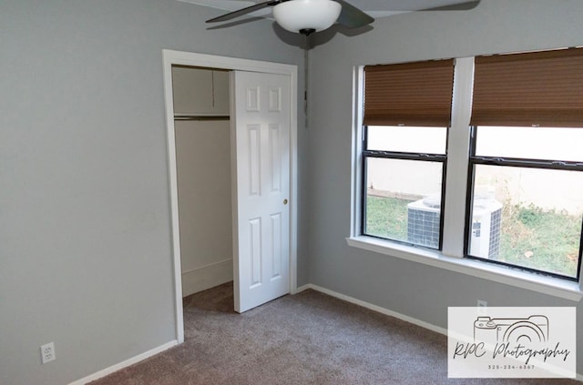 unfurnished bedroom featuring ceiling fan, carpet flooring, and a closet