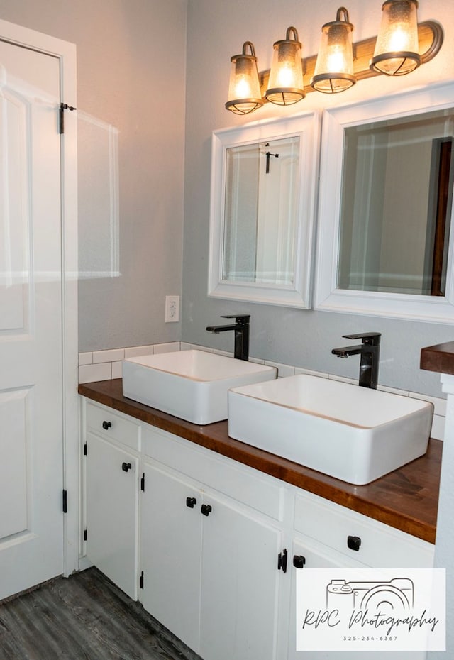 bathroom featuring hardwood / wood-style flooring and vanity