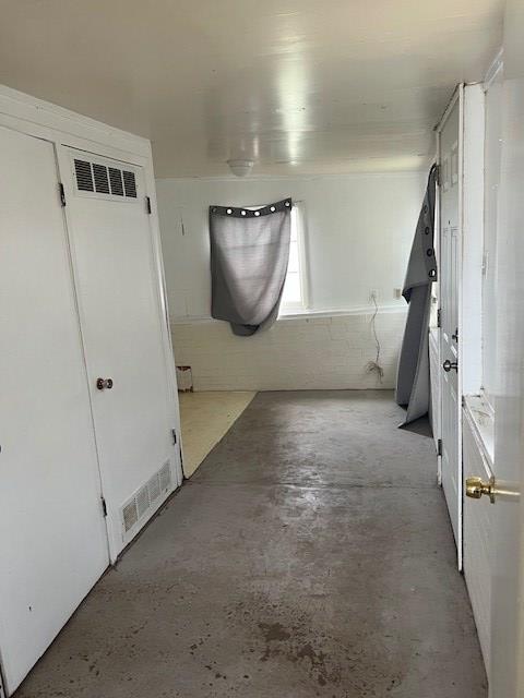 24 E 18th St, San Angelo, TX 76903 - hallway with visible vents and concrete floors