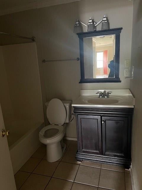 24 E 18th St, San Angelo, TX 76903 - full bathroom with crown molding, tile patterned floors, vanity, and toilet