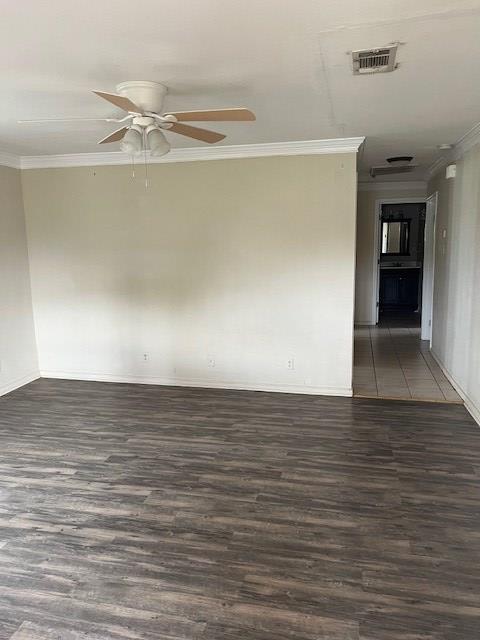 24 E 18th St, San Angelo, TX 76903 - empty room featuring dark wood-style flooring, baseboards, visible vents, a ceiling fan, and ornamental molding