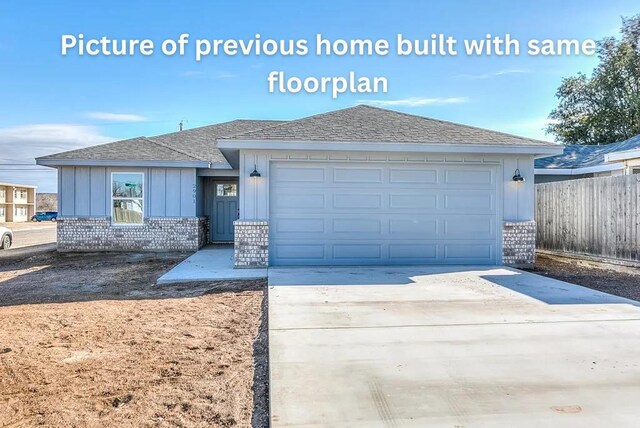 314 W 12th St, San Angelo, TX 76903 - view of front facade with brick siding, a shingled roof, driveway, fence, and a garage