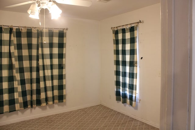 1008 10th St, Ballinger, TX 76821 - empty room featuring a ceiling fan and carpet floors