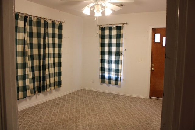 1008 10th St, Ballinger, TX 76821 - carpeted spare room featuring ceiling fan and baseboards