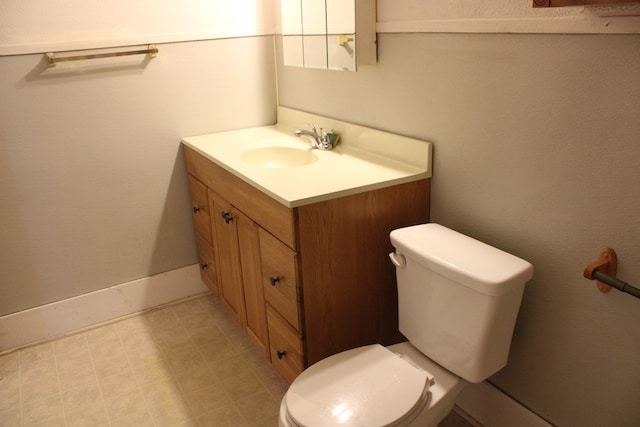 1008 10th St, Ballinger, TX 76821 - half bathroom with toilet and vanity