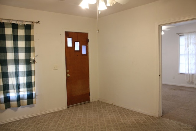 1008 10th St, Ballinger, TX 76821 - entrance foyer with carpet floors and a ceiling fan