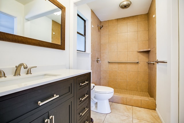 1617 Idaho Ave, San Angelo, TX 76904 - full bathroom featuring vanity, a tile shower, and tile patterned floors
