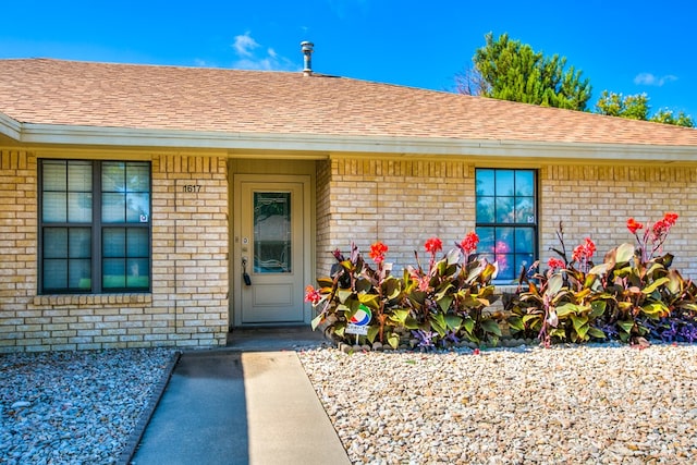 1617 Idaho Ave, San Angelo, TX 76904 - property entrance with brick siding and roof with shingles