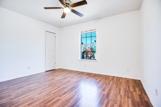 1617 Idaho Ave, San Angelo, TX 76904 - empty room with wood finished floors and a ceiling fan