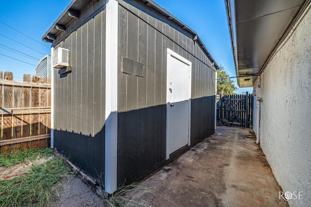 view of side of property with a shed