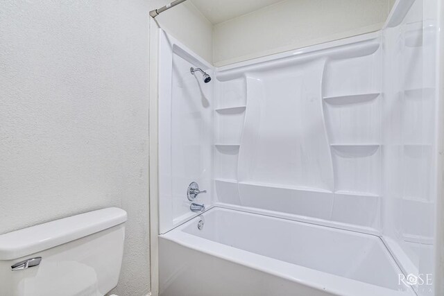 bathroom with toilet and shower / bathing tub combination