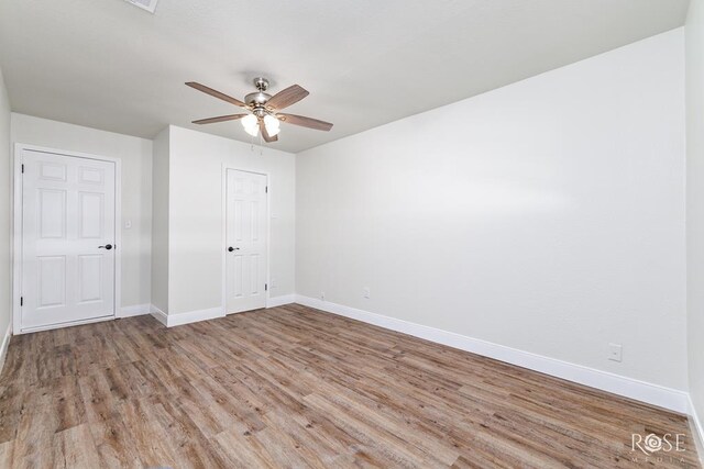 unfurnished bedroom with ceiling fan, a closet, and light wood-type flooring