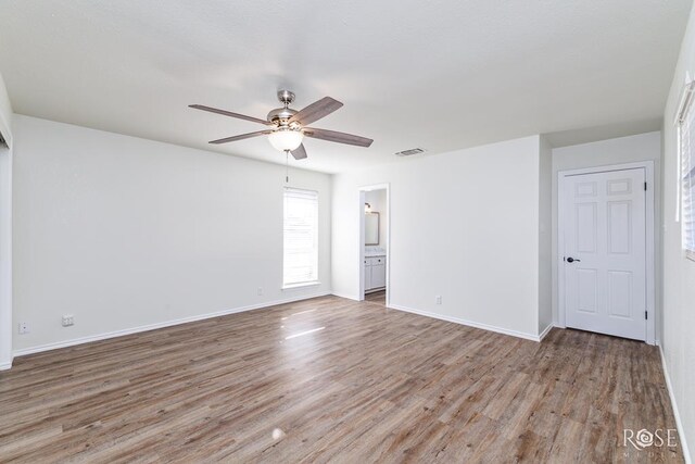 unfurnished room featuring ceiling fan and wood-type flooring