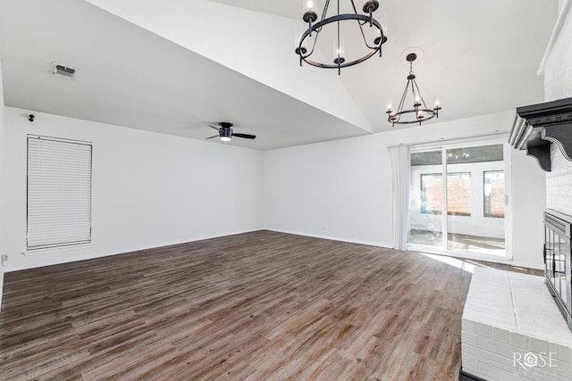 unfurnished living room with hardwood / wood-style flooring and ceiling fan with notable chandelier