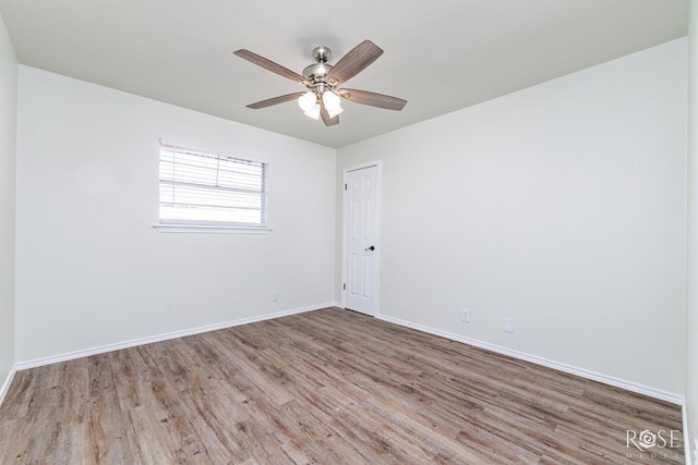 spare room featuring hardwood / wood-style flooring and ceiling fan