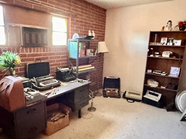 office space with brick wall