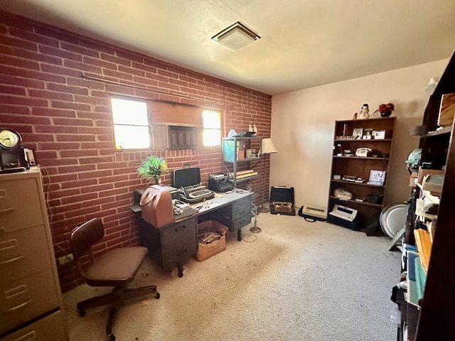 office space featuring brick wall