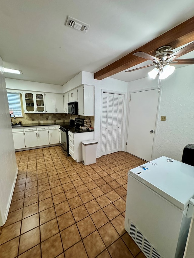 5214 Green Valley Trl, San Angelo, TX 76904 - kitchen featuring black appliances, backsplash, ceiling fan, beam ceiling, and white cabinetry