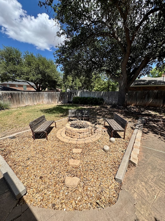 5214 Green Valley Trl, San Angelo, TX 76904 - fenced backyard featuring a fire pit