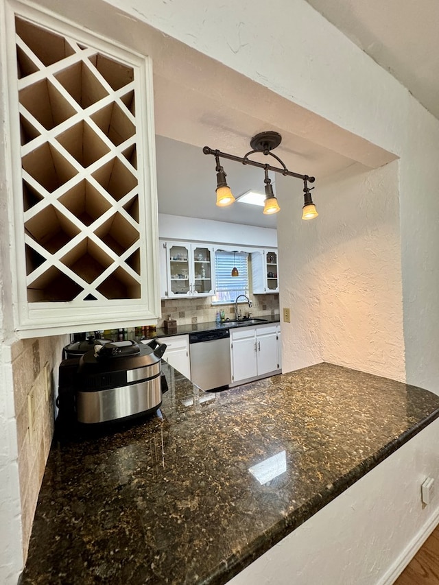 5214 Green Valley Trl, San Angelo, TX 76904 - kitchen featuring dishwasher, white cabinets, tasteful backsplash, glass insert cabinets, and dark stone countertops