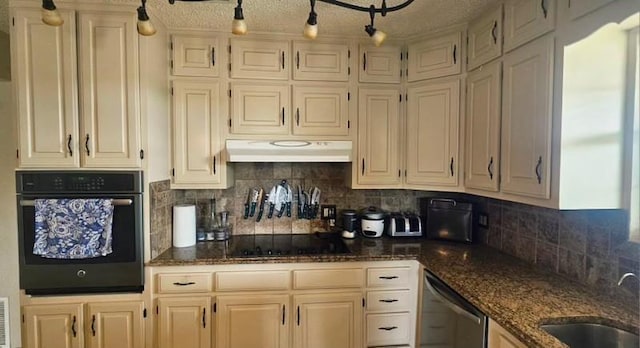 1210 Elizabeth St, Rankin, TX 79778 - kitchen with black appliances, a sink, under cabinet range hood, decorative backsplash, and dark stone counters