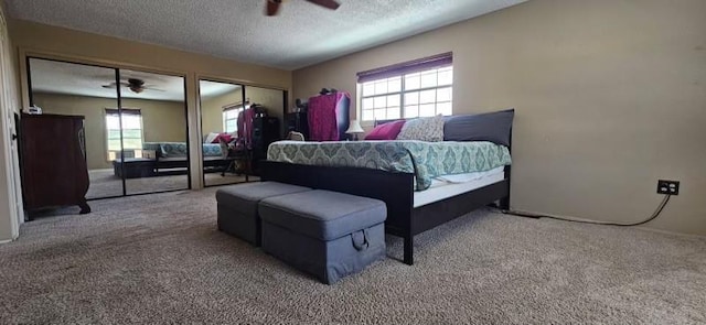 1210 Elizabeth St, Rankin, TX 79778 - carpeted bedroom with two closets, a textured ceiling, baseboards, and ceiling fan