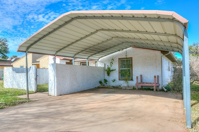 view of vehicle parking featuring a carport