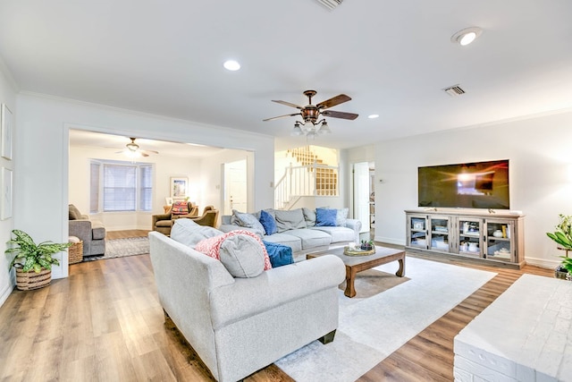 2805 Alta Vista Ln, San Angelo, TX 76904 - living area with stairs, ceiling fan, light wood-style flooring, recessed lighting, and crown molding