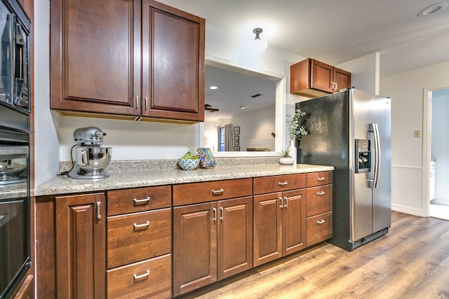 2805 Alta Vista Ln, San Angelo, TX 76904 - kitchen featuring stainless steel fridge, light wood-style flooring, wainscoting, and recessed lighting
