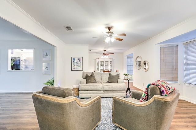 2805 Alta Vista Ln, San Angelo, TX 76904 - living area featuring wood finished floors, ceiling fan, and ornamental molding