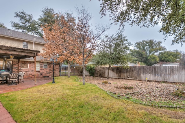 2805 Alta Vista Ln, San Angelo, TX 76904 - fenced backyard with a patio area