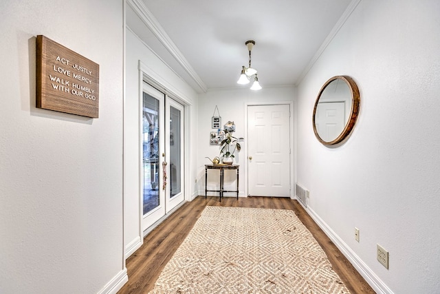 2805 Alta Vista Ln, San Angelo, TX 76904 - doorway with dark wood-style floors and crown molding