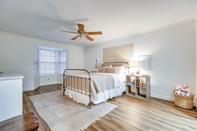 2805 Alta Vista Ln, San Angelo, TX 76904 - bedroom featuring crown molding, wood finished floors, and ceiling fan