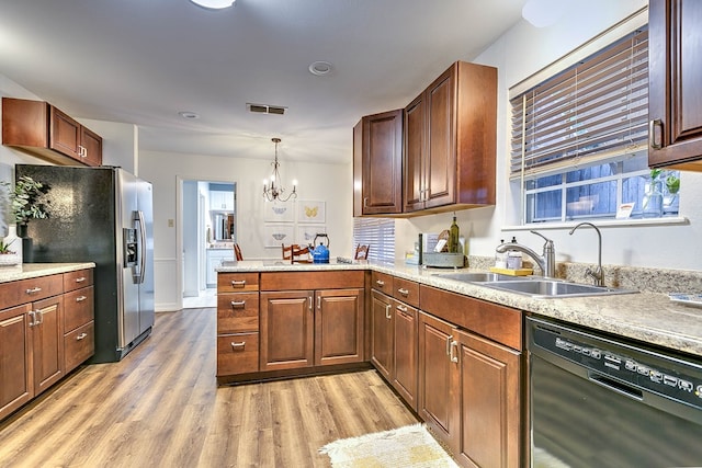 2805 Alta Vista Ln, San Angelo, TX 76904 - kitchen with dishwasher, stainless steel fridge with ice dispenser, light wood-style floors, a chandelier, and a peninsula
