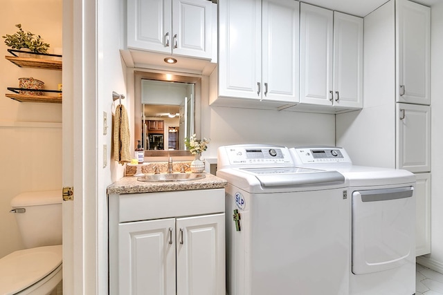 2805 Alta Vista Ln, San Angelo, TX 76904 - washroom featuring independent washer and dryer and cabinet space