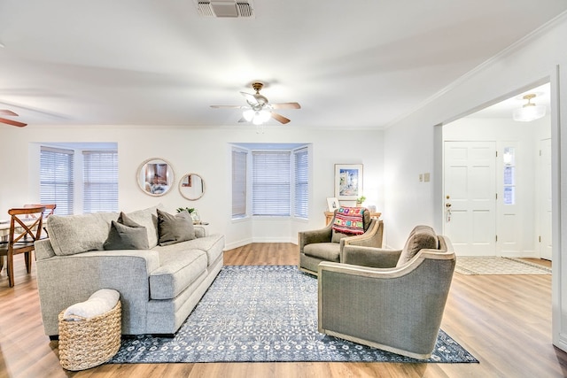 2805 Alta Vista Ln, San Angelo, TX 76904 - living room with ceiling fan, wood finished floors, and ornamental molding
