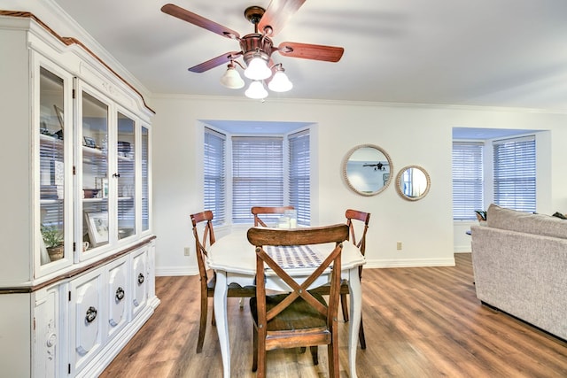 2805 Alta Vista Ln, San Angelo, TX 76904 - dining room featuring crown molding, wood finished floors, and ceiling fan