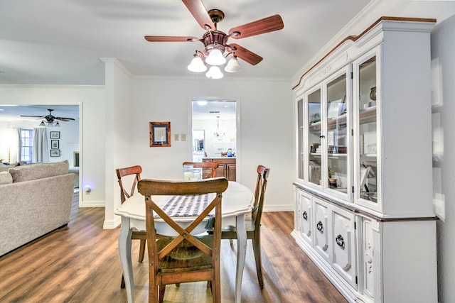2805 Alta Vista Ln, San Angelo, TX 76904 - dining space with a ceiling fan, wood finished floors, and ornamental molding