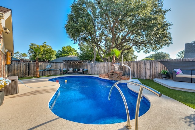 view of swimming pool featuring a patio area