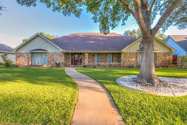 ranch-style home featuring a front yard