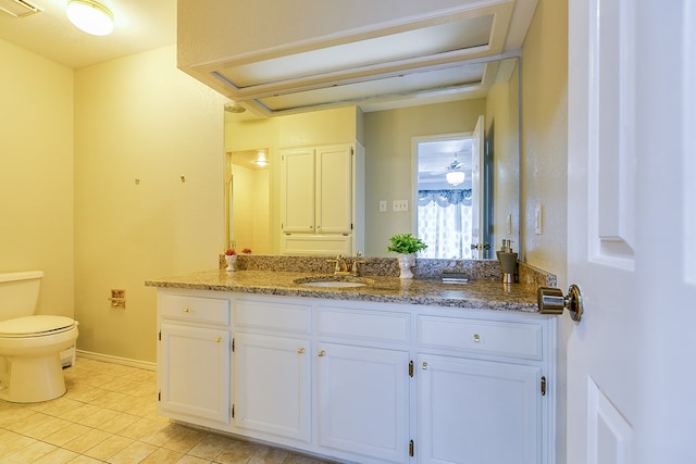 bathroom with tile patterned floors, vanity, and toilet