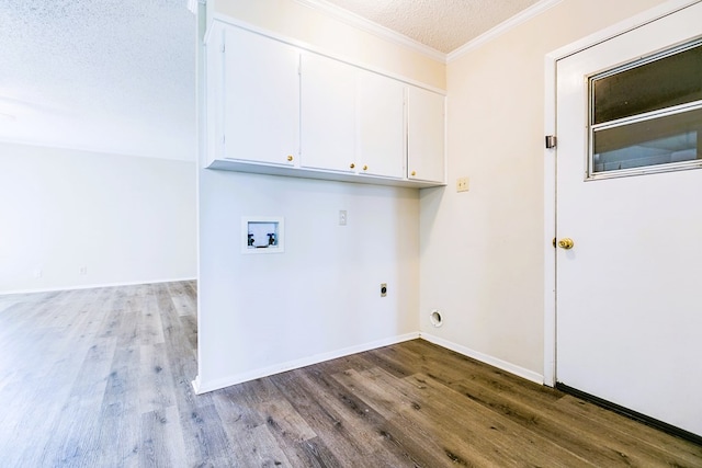 2410 Louise Dr, San Angelo, TX 76901 - laundry area with cabinet space, washer hookup, wood finished floors, a textured ceiling, and electric dryer hookup