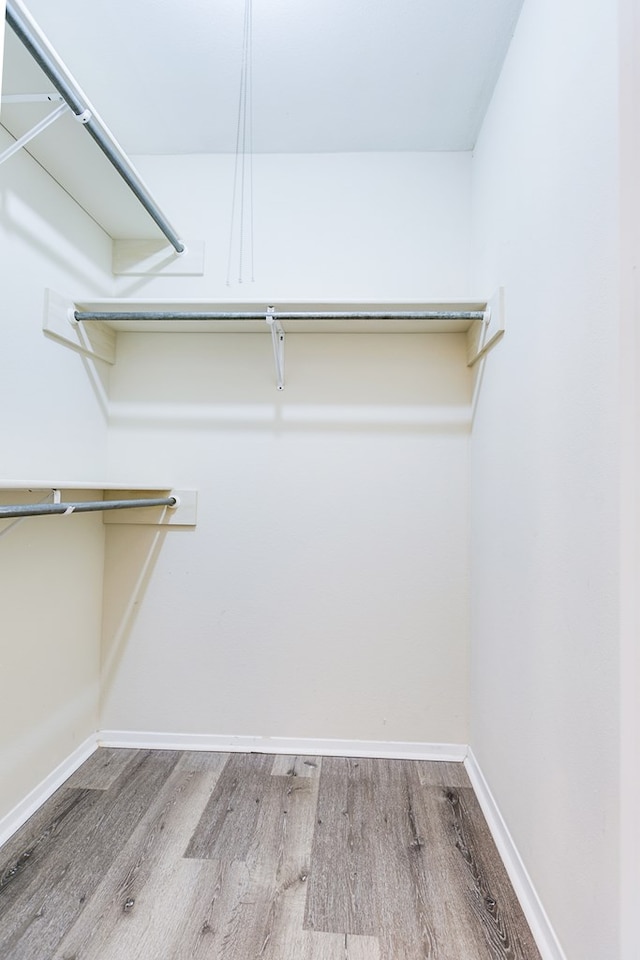 2410 Louise Dr, San Angelo, TX 76901 - walk in closet featuring wood finished floors