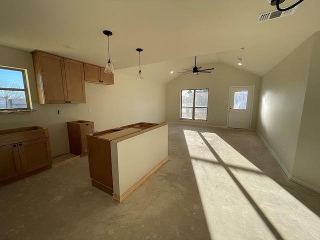 kitchen featuring lofted ceiling, ceiling fan, decorative light fixtures, and a healthy amount of sunlight