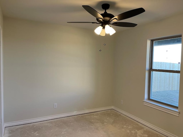 unfurnished room with ceiling fan and a wealth of natural light