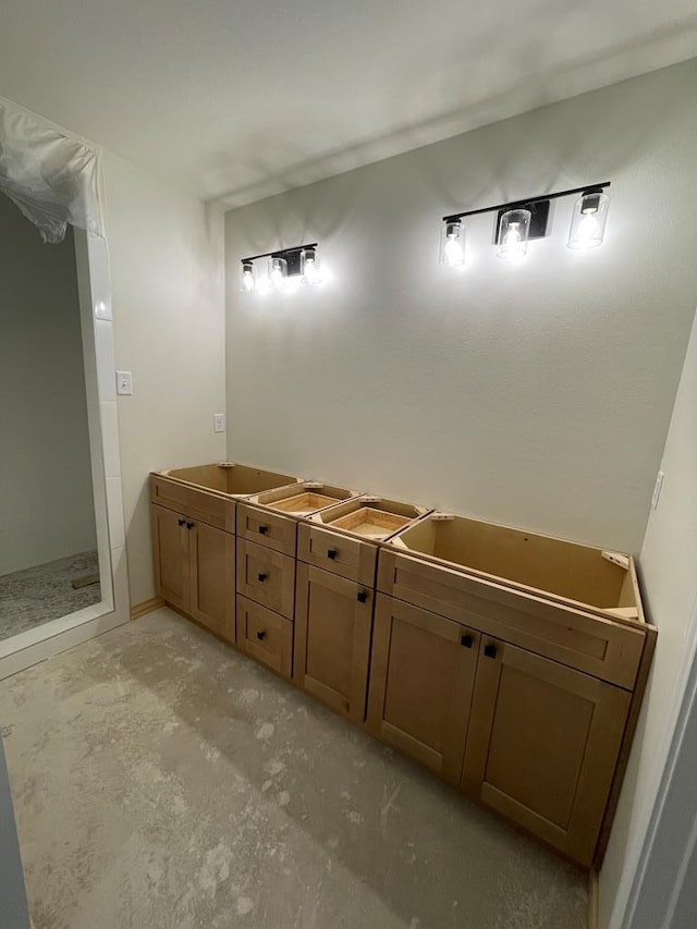 bathroom with sink and concrete flooring